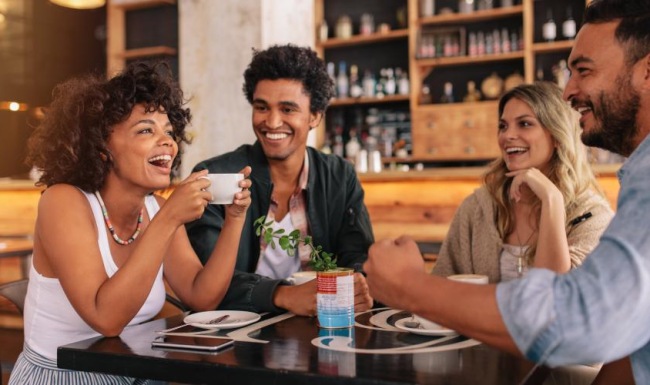 Vibrant community life with a variety of dining options a group of people sitting at a table